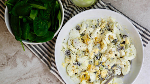 Keto Egg Salad with Olives over Spinach